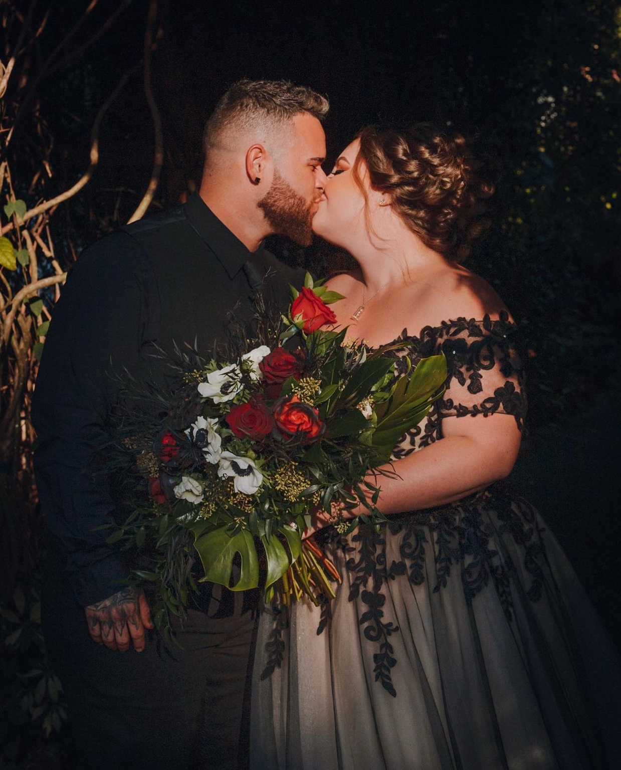 Bride and groom together after dark
