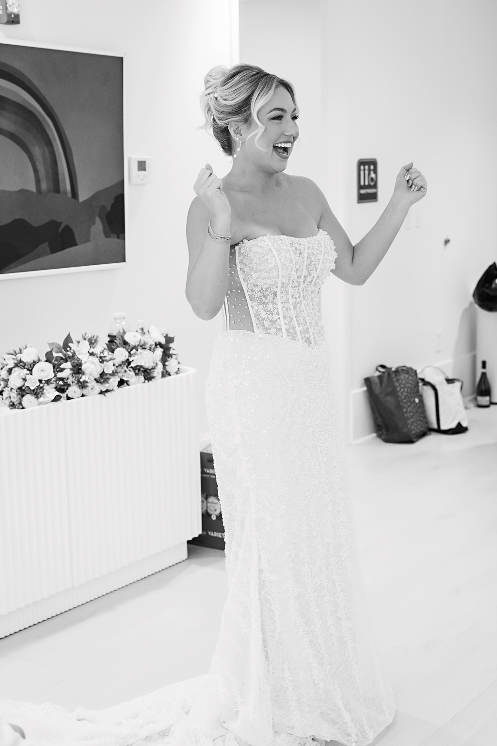 Bride celebrating in her wedding dress
