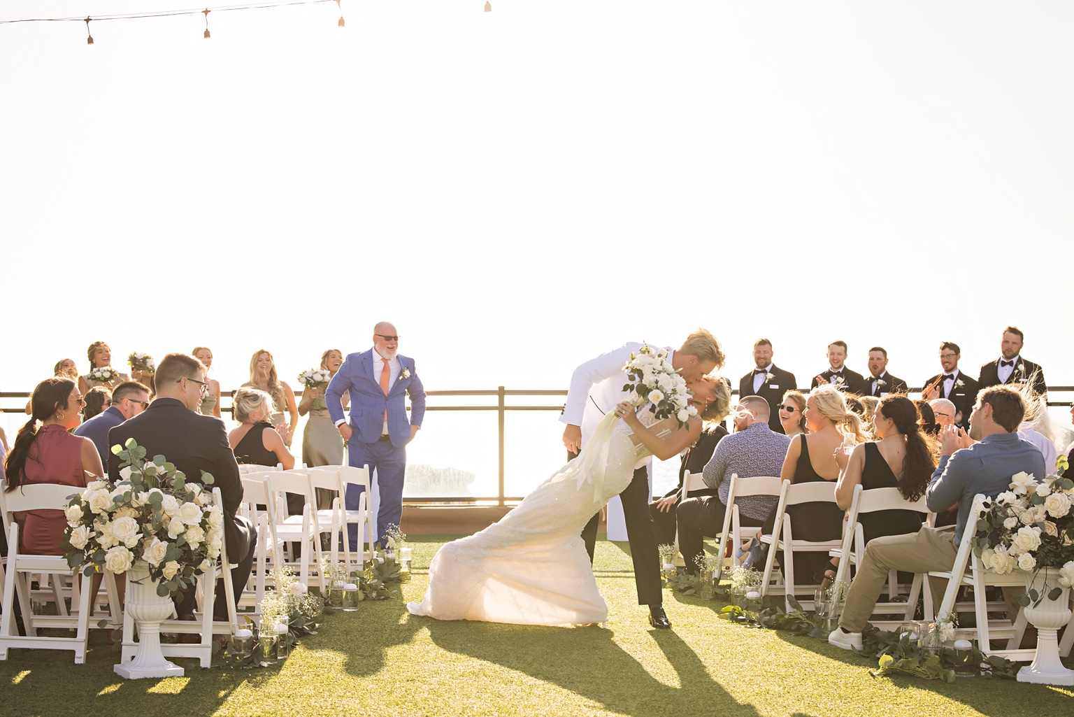 Couple kissing at the outdoor ceremony