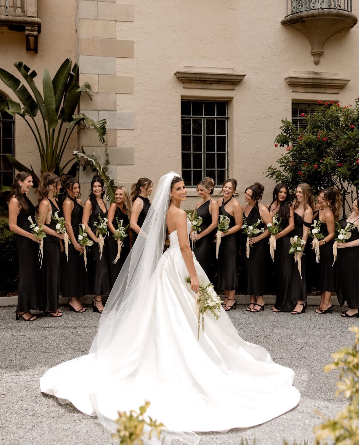Bride and bridesmaids together outside the venue