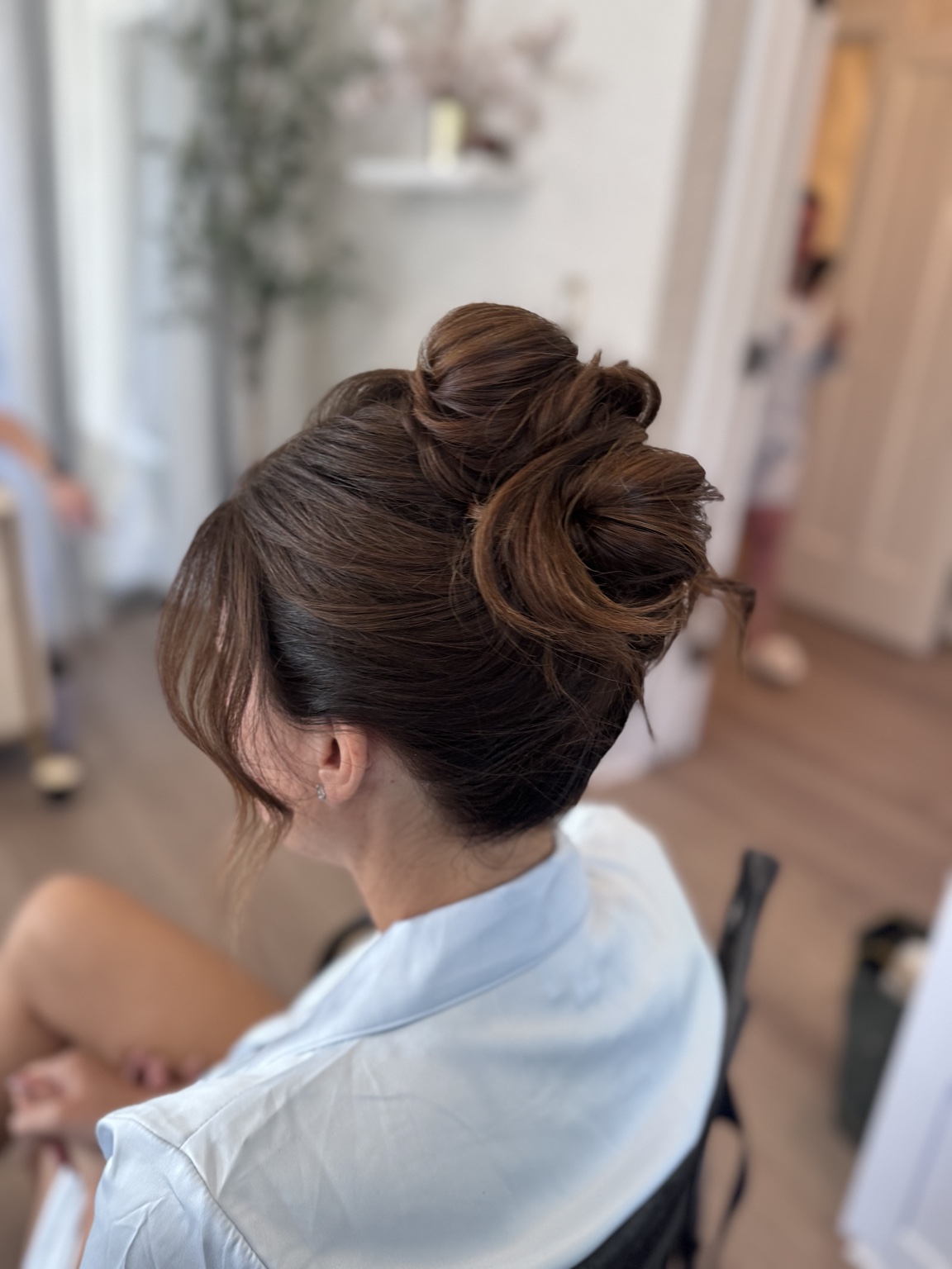 Sculpted brunette bridal bun from behind