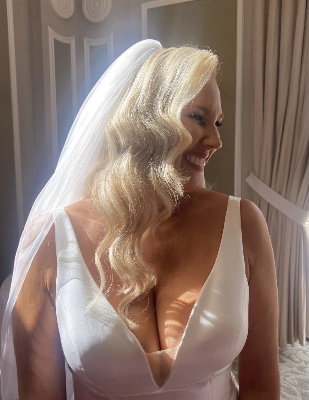 Long blonde bridal waves with veil