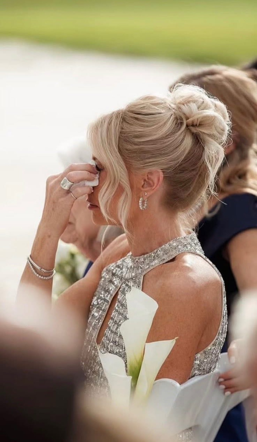 Blonde curled bridal updo seen in profile